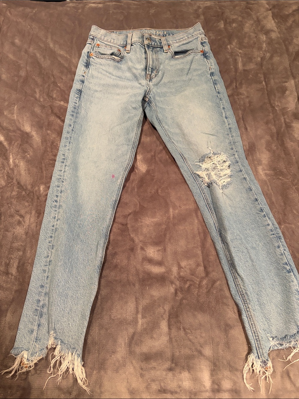 American Eagle Outfitters Light Wash Skinny Jeans with Distressed Hem